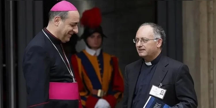 Faith _ Archbishop Victor Fernandez, who has been archbishop of La Plata, Argentina since 2018, talks with Jesuit Father Antonio Spadaro, editor of La Civilta Cattolica, as they leave a session of the Synod of Bishops on the family at the Vatican Oct. 14, 2015